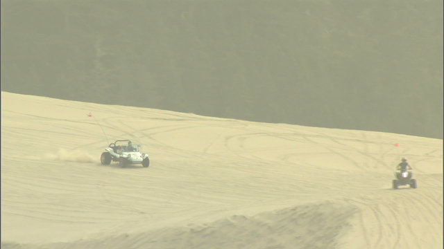 Oregon dunes buggie and 4 wheeler in sand