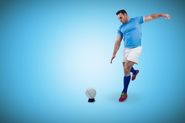 Naklejka premium Composite image of rugby player ready to kick