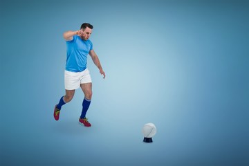 Fototapeta na wymiar Composite image of rugby player ready to kick