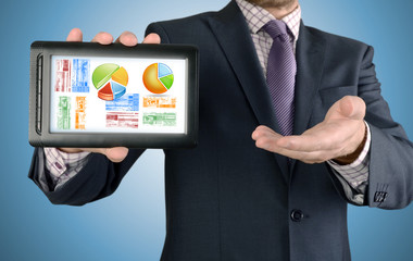 businessman working on financial graph on tablet