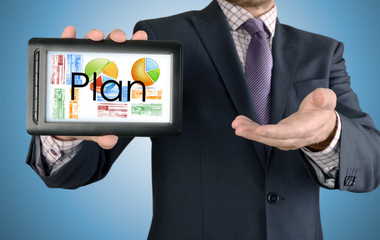 Businessman showing business concept on tablet - Plan