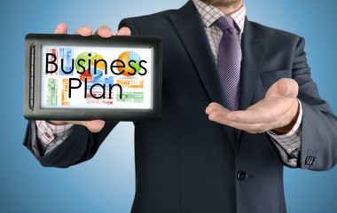 Businessman showing business concept on tablet - Business Plan