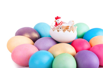 Chicken toy on easter eggs closeup