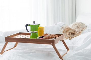 Breakfast tray with coffee and croissant