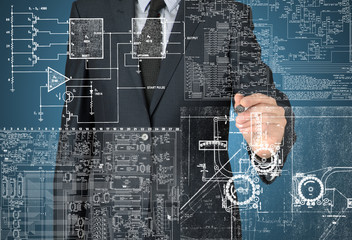 businessman writing and drawing some sketches