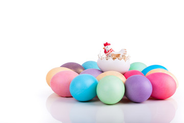 Chicken toy on easter eggs closeup