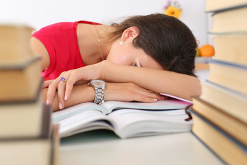 Tired female student at workplace
