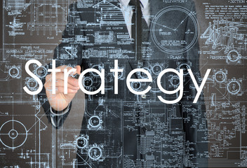 Businessman sketching and writing strategy