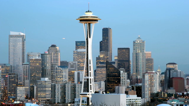 The Seattle Space Needle stands at the center of this time lapse shot of Seattle's skyline.