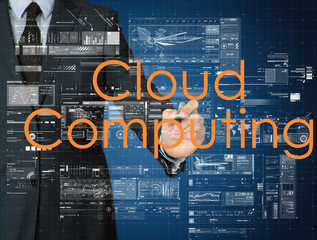the businessman is writing Cloud Computing on the transparent bo
