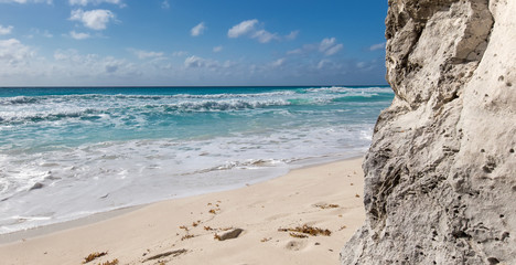 Ocean with waves and rocks on beach