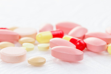Obraz na płótnie Canvas Multicolored Tablets of medicine on white background.