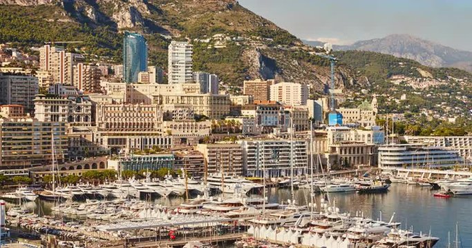 Monaco, Monte-Carlo, 07.09.2015: Port Hercules at sunset, port de Hercule, luxury yachts, big boat, yacht show, mediterranean sea, time-lapse 4k video, motor boat, princes palace of monaco