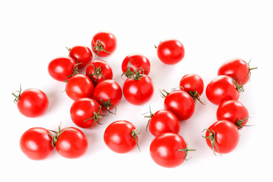 Group of ripe red tomatoes on a white