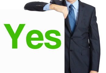 Businessman holding or showing banner with text Yes
