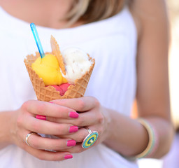 Woman hands holding fruity ice cream in hands