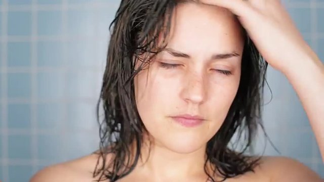 healthy young woman in bathroom waking up portrait