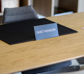 GUEST MANAGER sign in hotel lobby