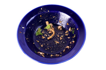 Waste of food in dirty blue bowl