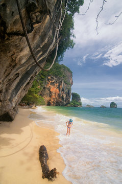 Tropical Phra Nang beach landscape under a huge cave in the Krabi province, Thailand