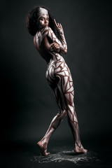 Fototapeta na wymiar Gorgeous and sensual african model body covered with painted pol