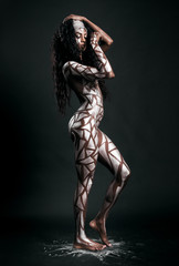 Beautiful african model body covered with painted polygons