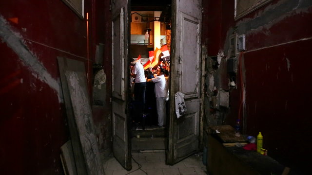 A doorway frames protestors in Cairo, Egypt.