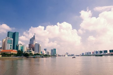 Fototapeta premium Cityscape of Saigon downtown, viewed from top of building. Saigon (Ho Chi Minh city) is the largest city in Vietnam with population around 10 million people.