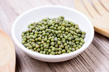 Green mung beans in ceramic bowl