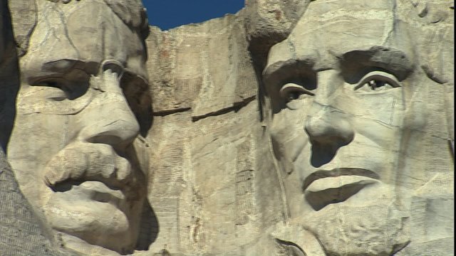 Pan of faces on Mt. Rushmore