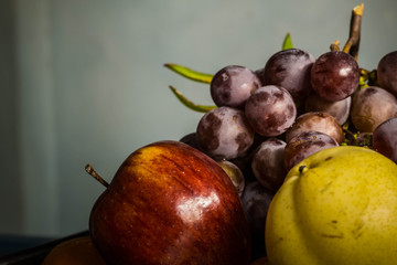 many fruits in a tray on the table.