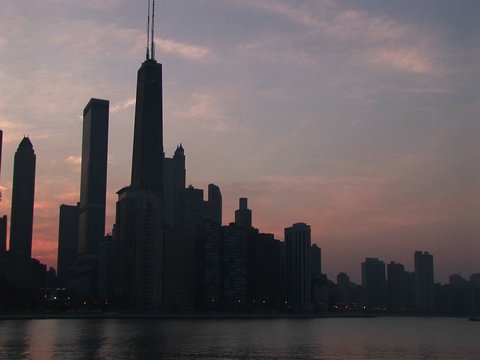 Medium shot of the Chicago skyline at golden hour from Lake Michigan.