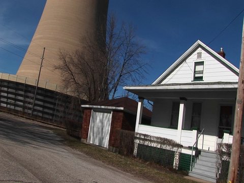 A look from street-level and a residential home to the top of a nearby nuclear power plant.