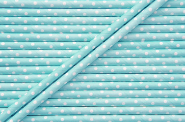 Blue and white polka dot paper straw background