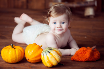 baby and pumpkins