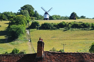 Windmill seen over village rooftops, Turville.