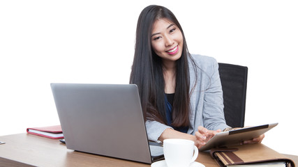Businesswoman reading latest news on tablet