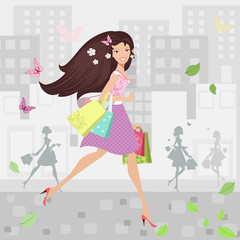 Happy girl walking around town with shopping bags