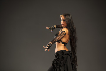 Close up of beautiful woman performing tribal dance