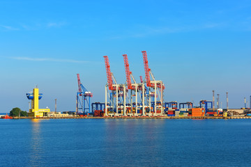 Obraz premium orange industrial cranes