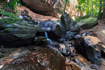 A beautiful Pathway under rock and water falls. to beautiful big water falls in local city,thailand.
