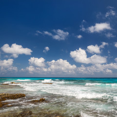 Fototapeta na wymiar Ocean with waves and rocks on beach