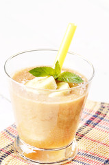 Carrot and banana shake on white table