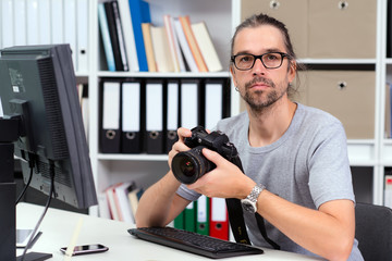 photographer working in his office