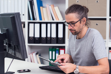 man is working in his office