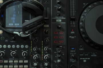 Obraz premium Mixer console and headphones