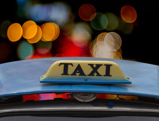 Taxi sign at night