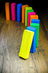 The domino effect of colorful wooden blocks, Selective focus