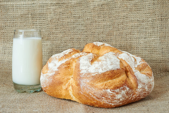A glass of milk with bread