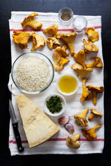 ingredients for cooking mushrooms chanterelles. parmesan cheese,